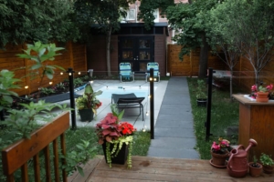 Beautiful wooden fence outlining backyard with pool 